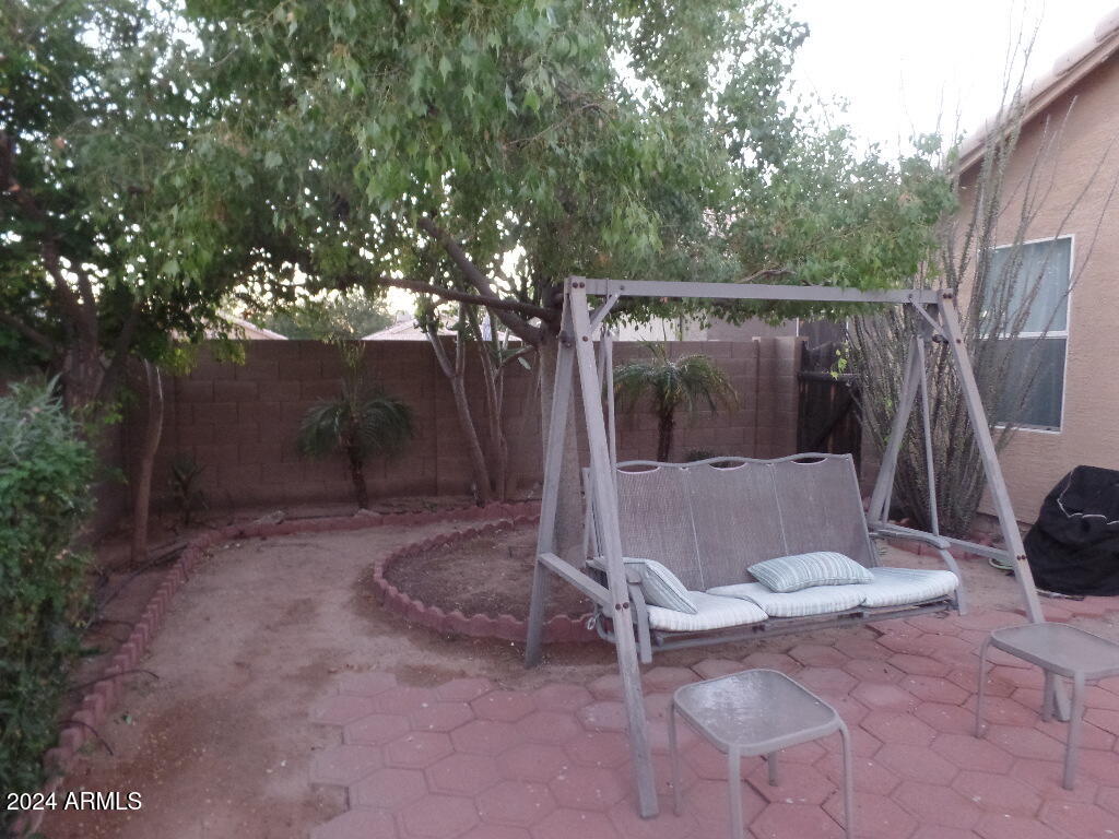 1873 West Renaissance Avenue Apache Junction, AZ 85120 - Photo 18 of 18 a view of a chair and tables in the patio