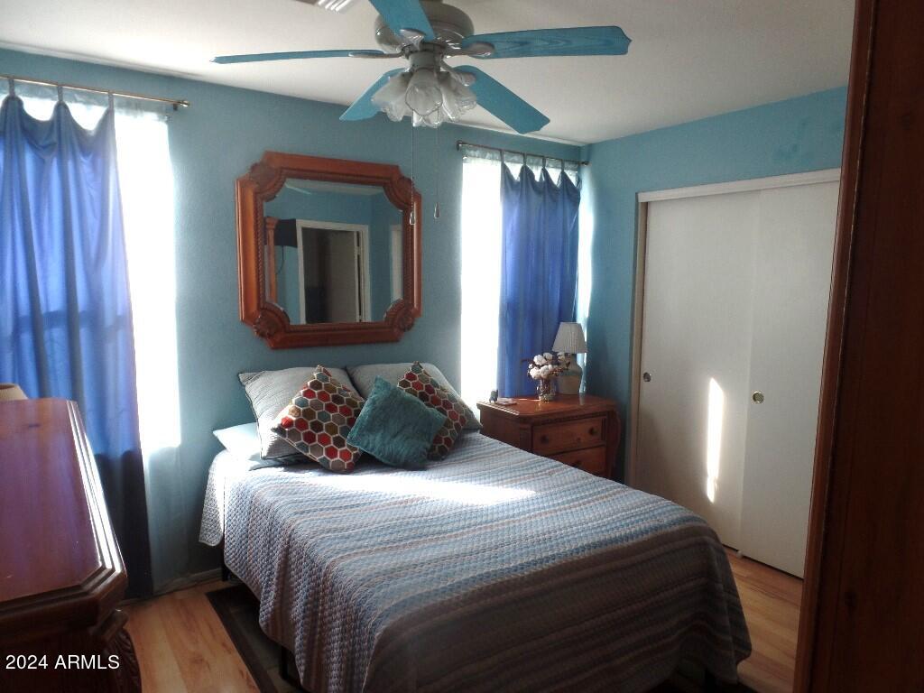 1873 West Renaissance Avenue Apache Junction, AZ 85120 - Photo 10 of 18 a bedroom with a bed and a mirror