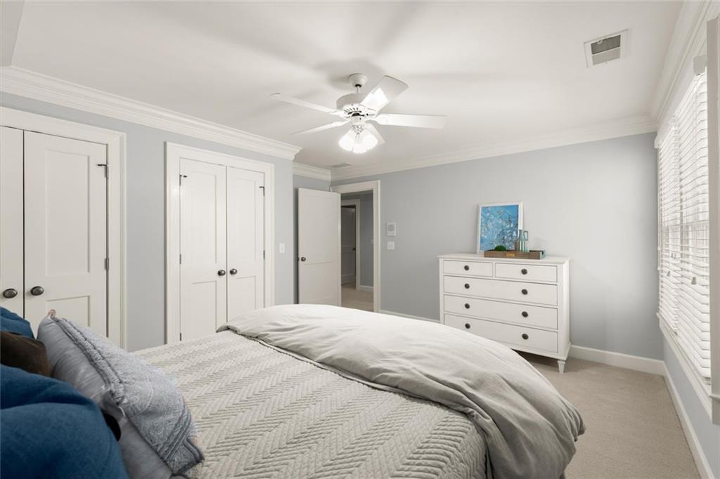 1450 Acworth Due West Road Northwest Kennesaw, GA 30152 - Photo 44 of 77 a bedroom with a bed and a chandelier fan
