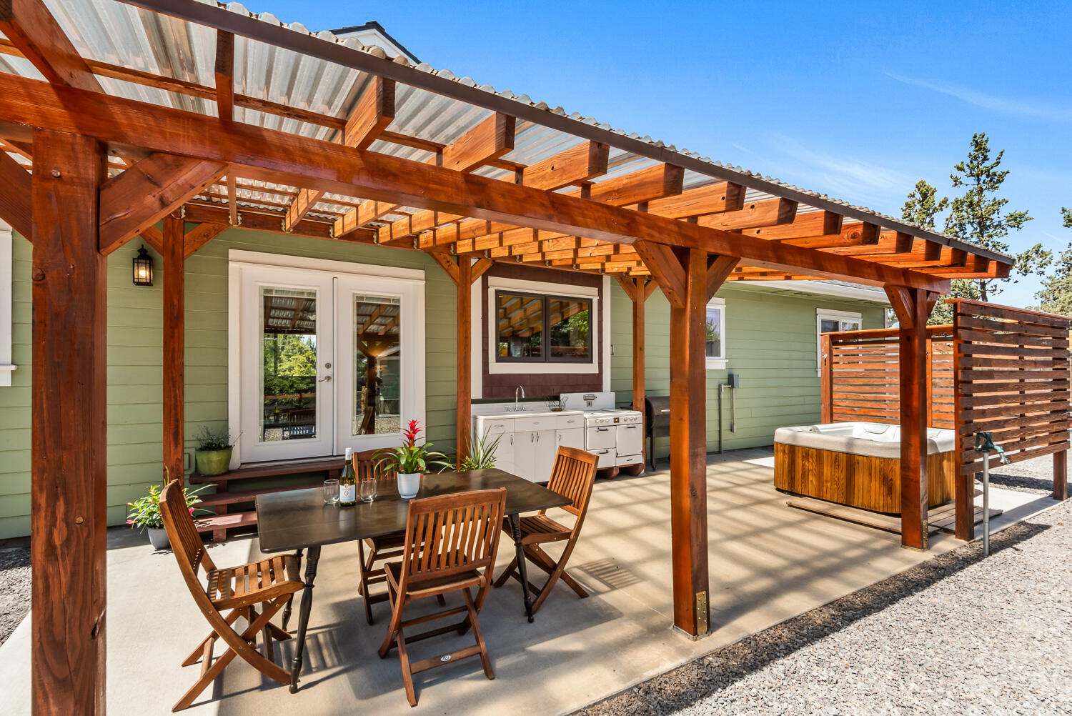 63406 Vogt Road Bend, OR 97701 - Photo 18 of 27 Backyard covered patio with hot tub