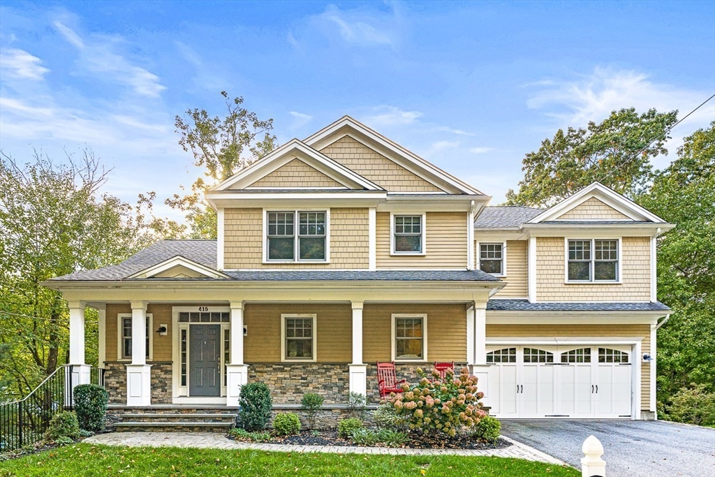 front view of a house with a yard