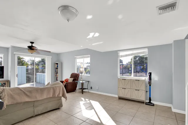a living room with furniture and windows