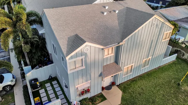 an aerial view of a house with outdoor space