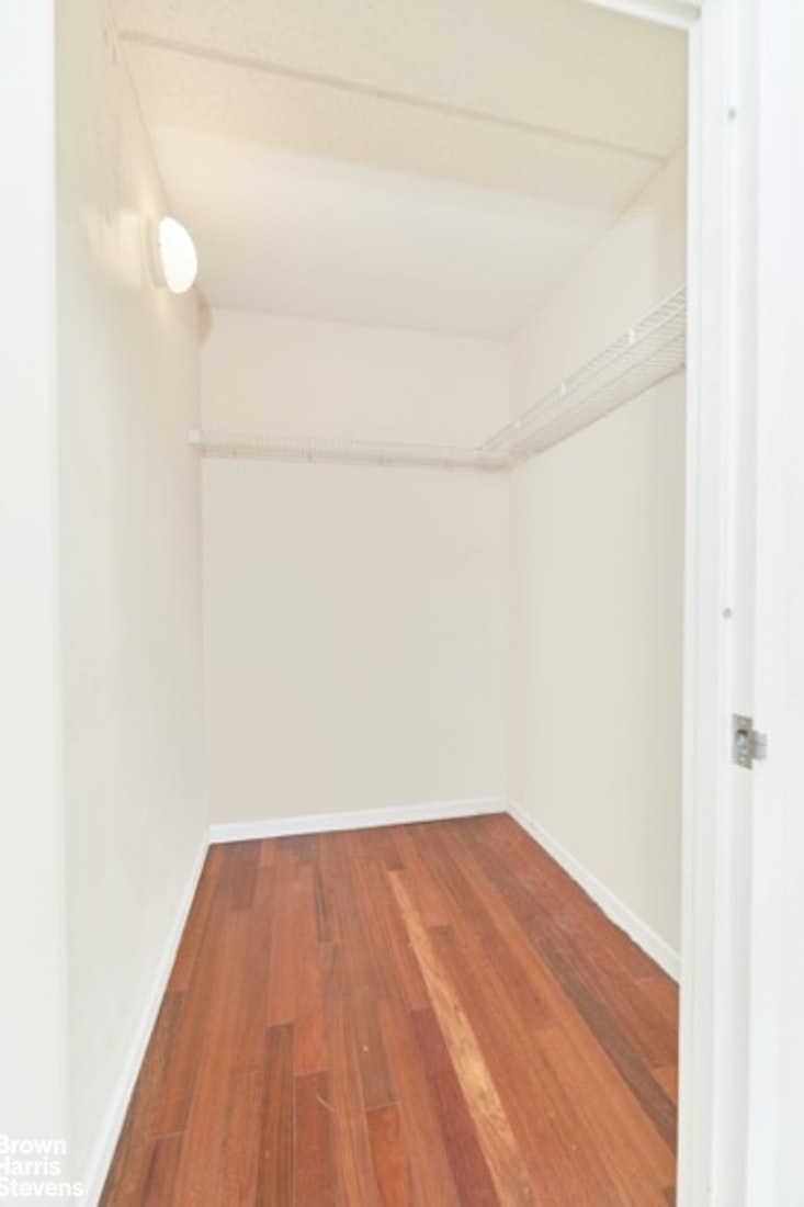 a view of a small space with wooden floor