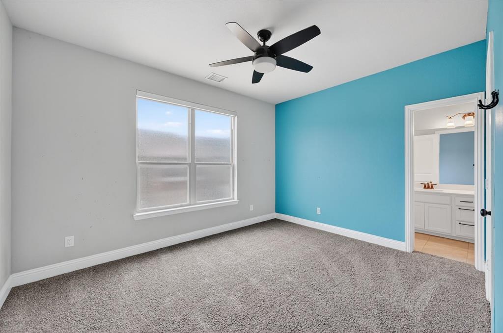 4224 Riverside Drive Flower Mound, TX 75028 - Photo 13 of 23 an empty room with windows and closet