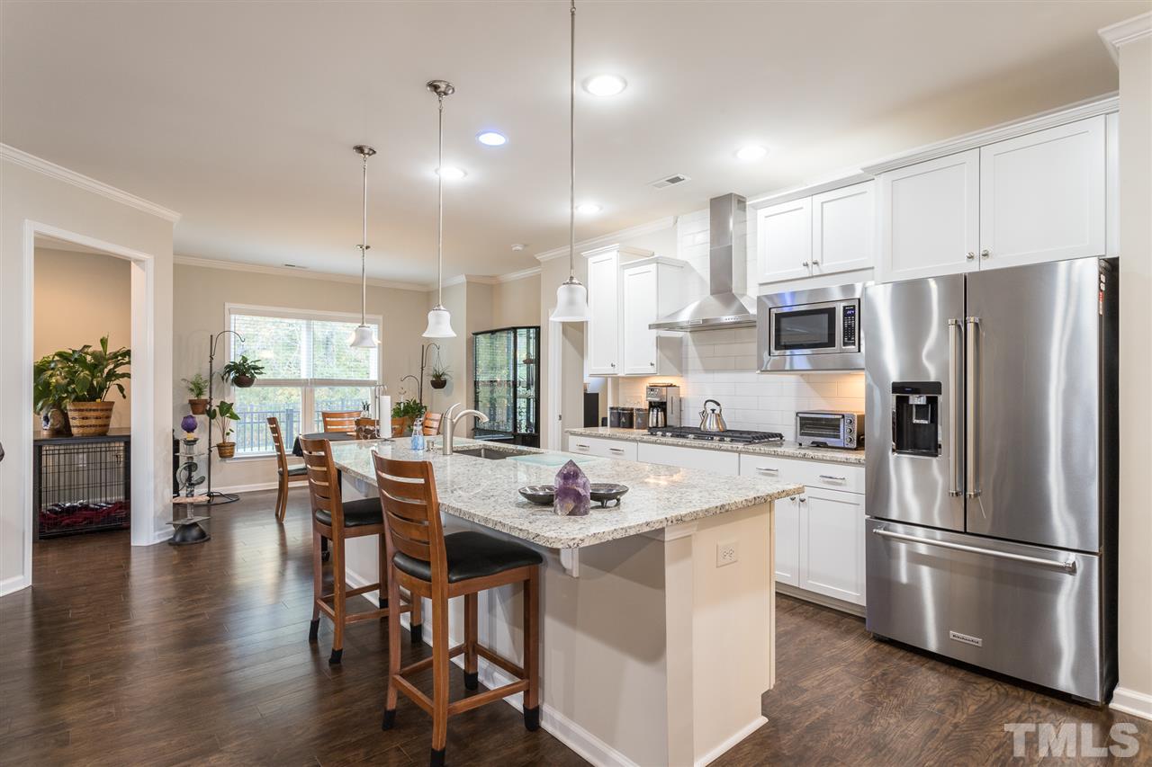 207 Tuttle Road Durham, NC 27703 - Photo 8 of 29 5-burner gas cooktop, 2 wall ovens, center island with eat-in bar, and 2 pantries!