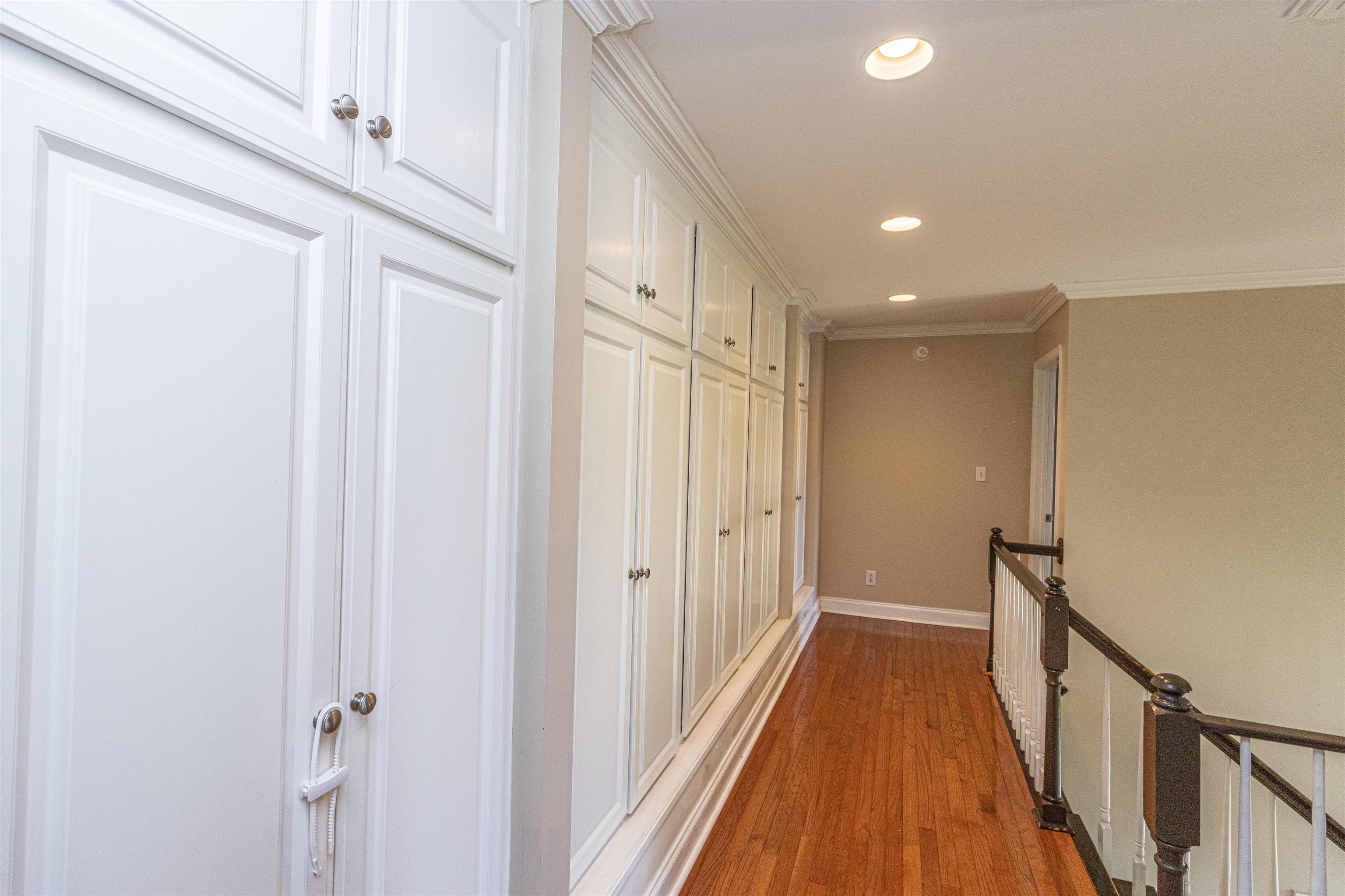 3501 Blue Bird Lane Corinth, MS 38834 - Photo 17 of 25 a view of a hallway with wooden floor and staircase