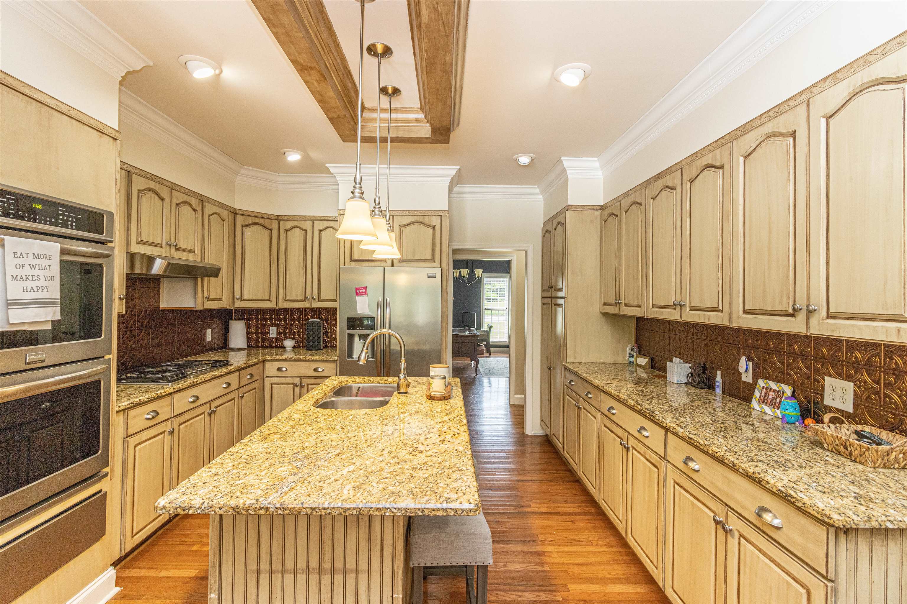 3501 Blue Bird Lane Corinth, MS 38834 - Photo 6 of 25 a large kitchen with kitchen island granite countertop a large counter top appliances and cabinets