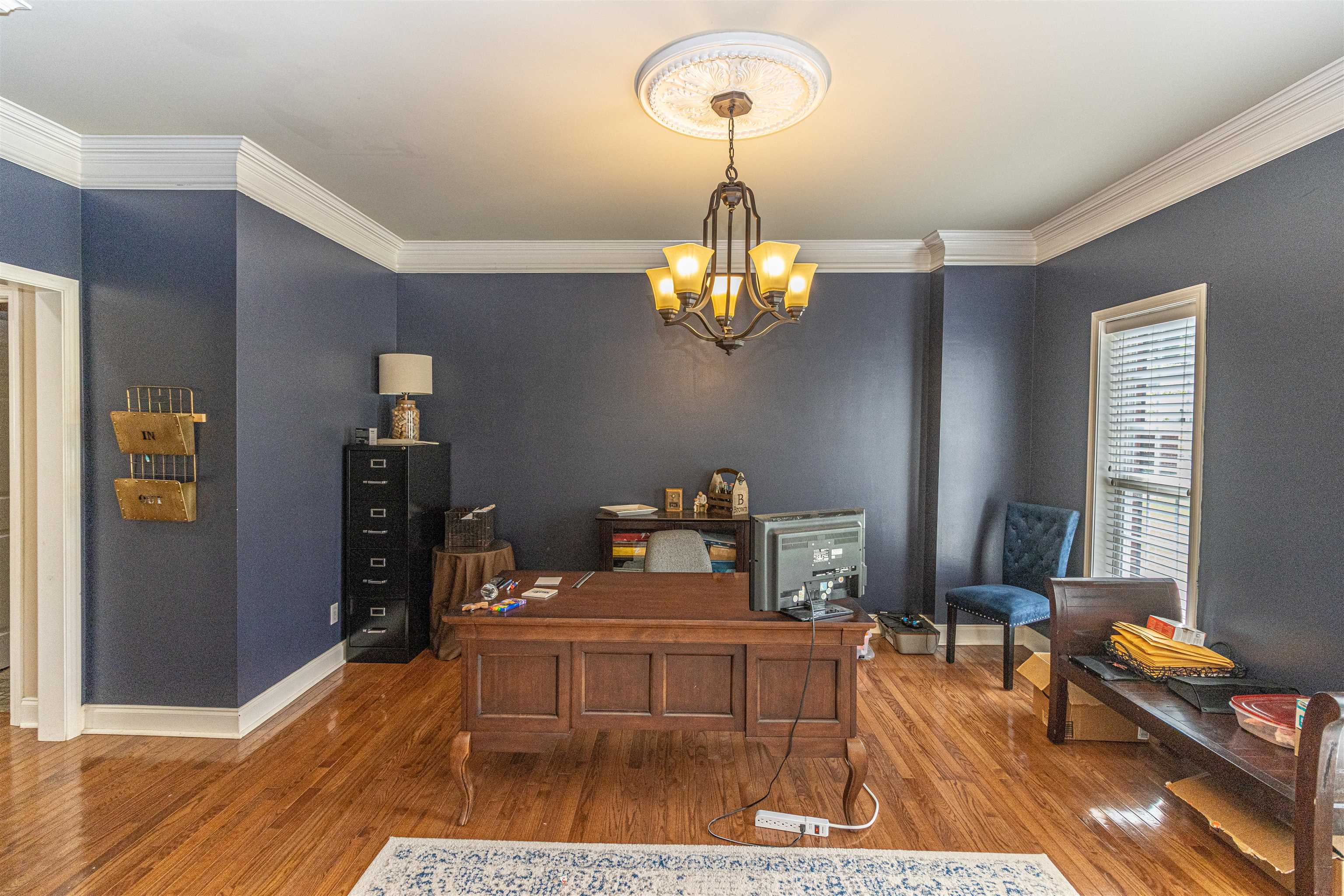 3501 Blue Bird Lane Corinth, MS 38834 - Photo 10 of 25 a living room with furniture and a chandelier