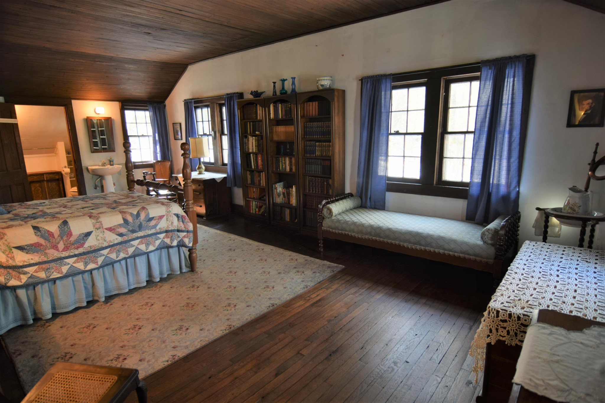 2338 Bear Creek Road Oneida, TN 37841 - Photo 24 of 40 a bedroom with a bed a couch and large window