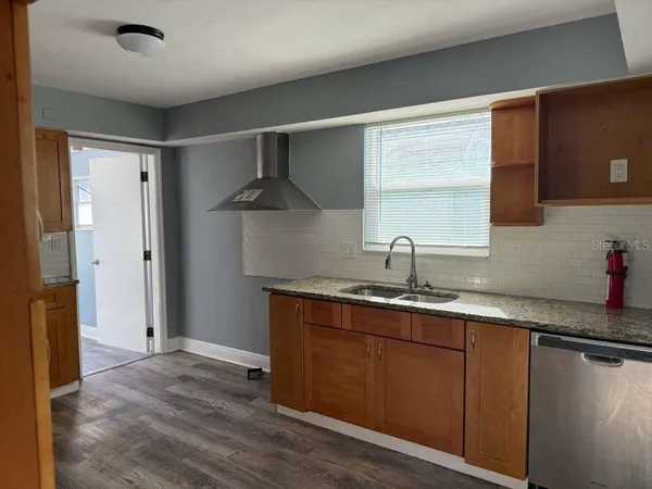 a kitchen with a sink and a window
