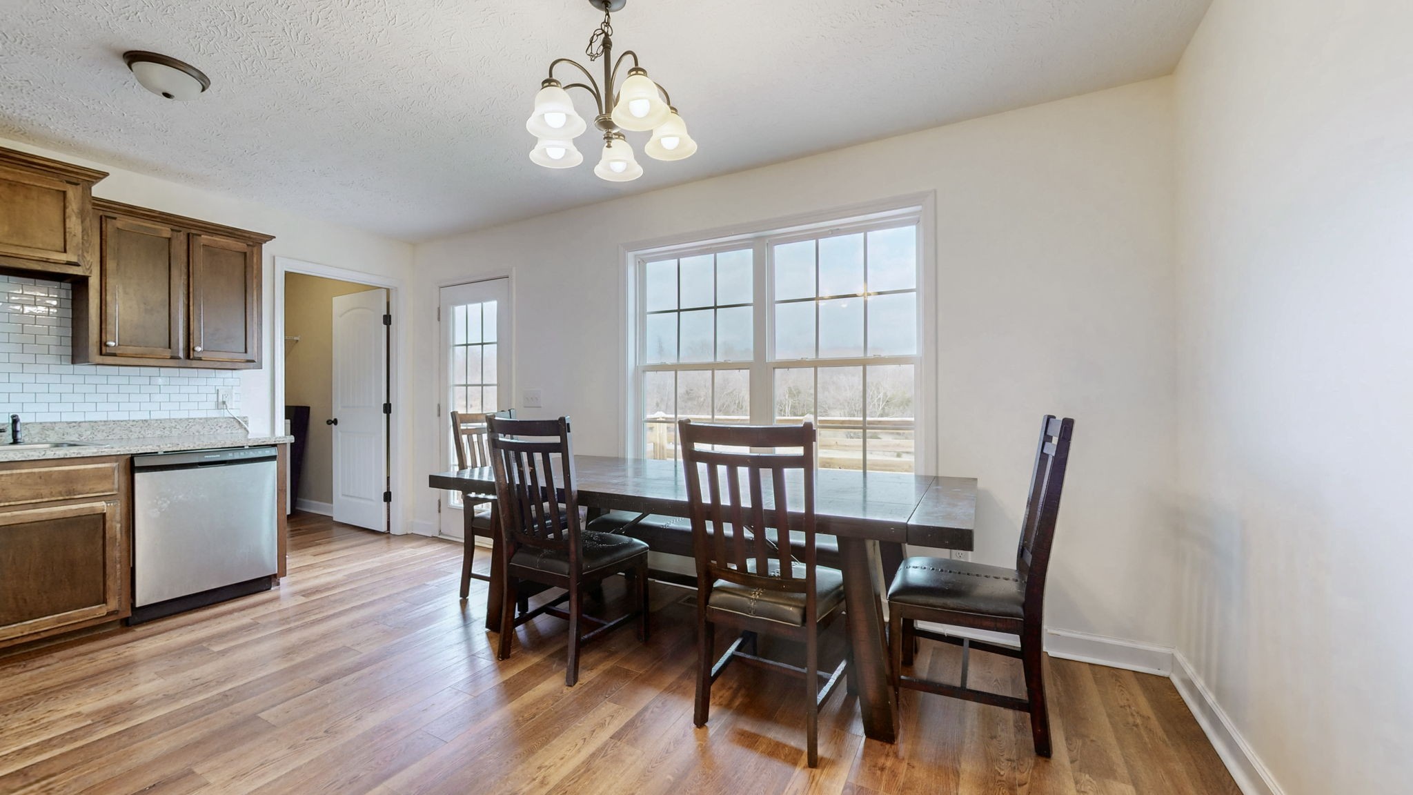 574 Keytown Road Portland, TN 37148 - Photo 12 of 45 a view of a dining room with furniture and wooden floor