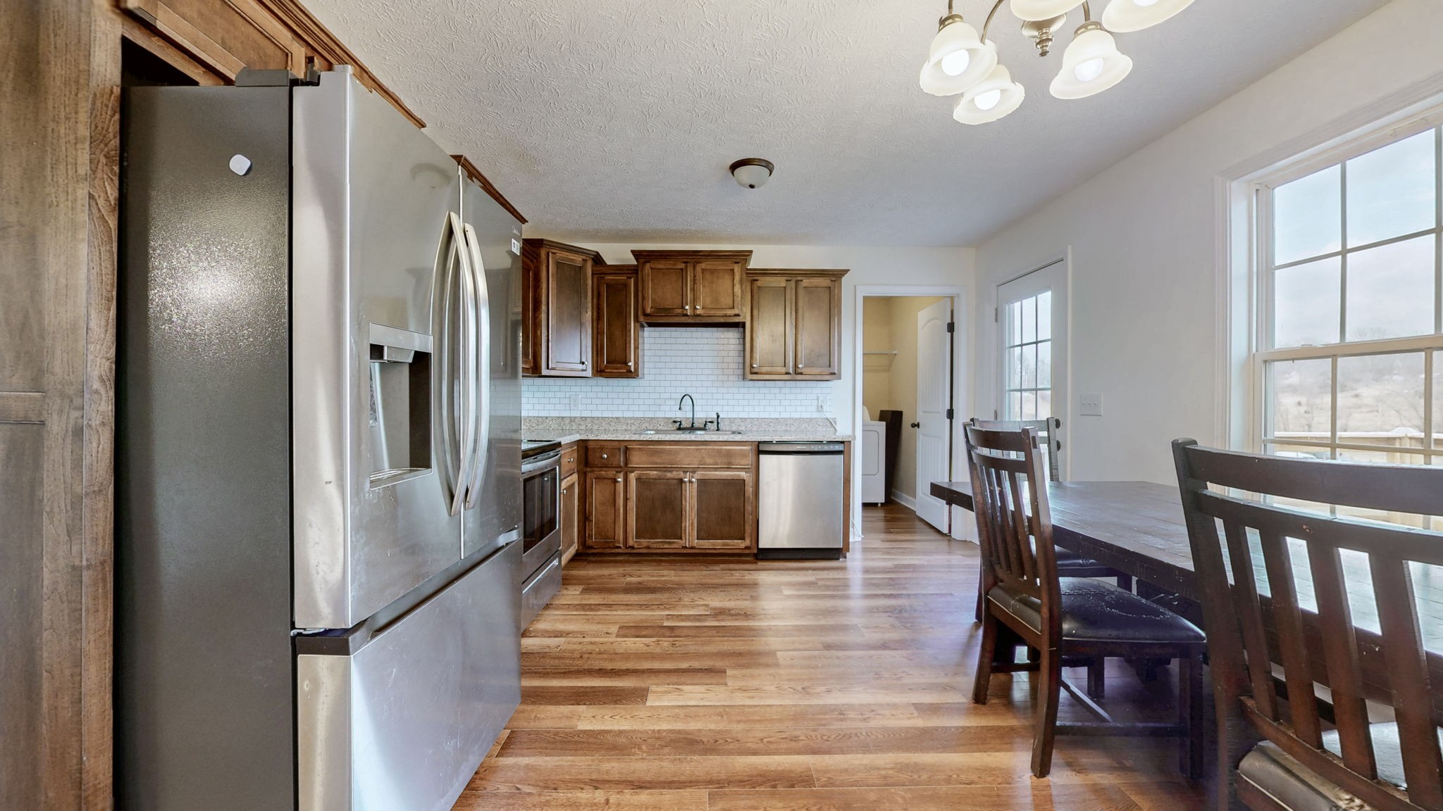 574 Keytown Road Portland, TN 37148 - Photo 13 of 45 a large kitchen with a table and chairs