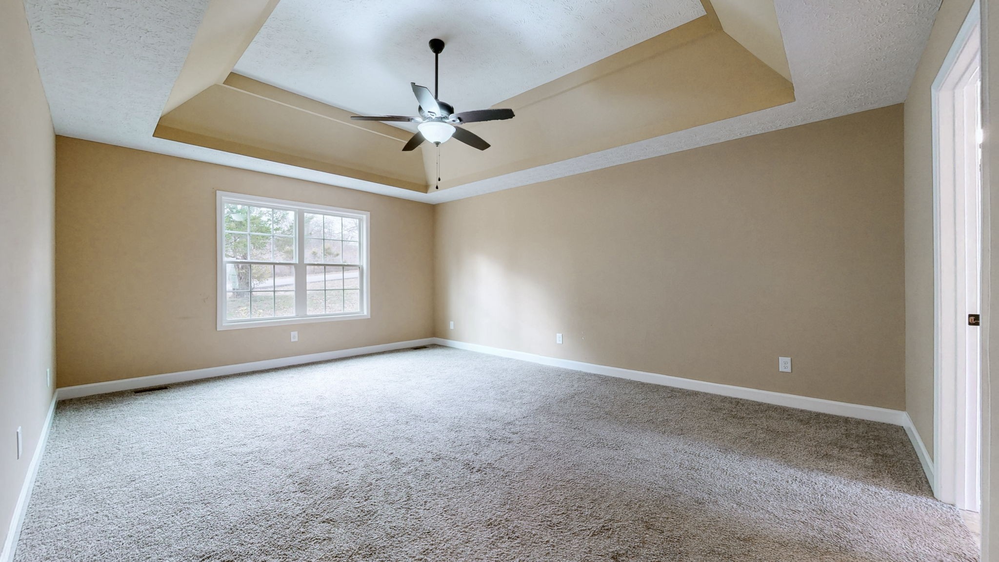 574 Keytown Road Portland, TN 37148 - Photo 20 of 45 an empty room with windows and chandelier fan