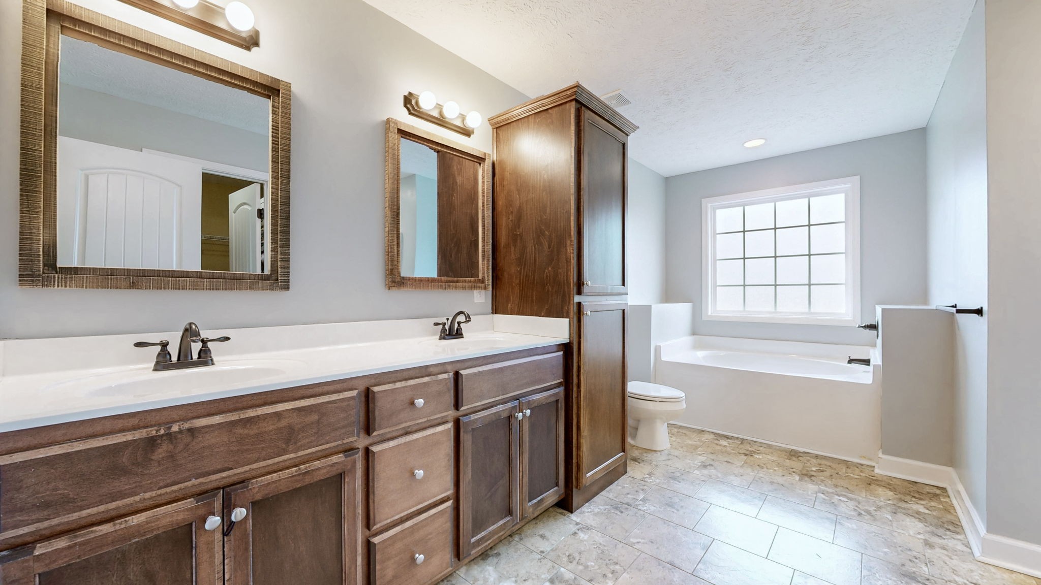 574 Keytown Road Portland, TN 37148 - Photo 22 of 45 a bathroom with a double vanity sink toilet mirror and bathtub