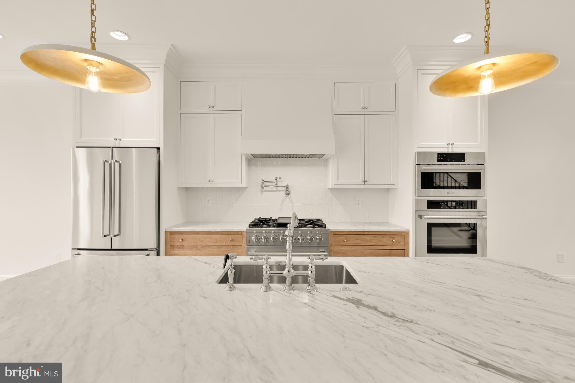 1010 I Street Northeast Washington, DC 20002 - Photo 11 of 51 a living room with furniture and a chandelier