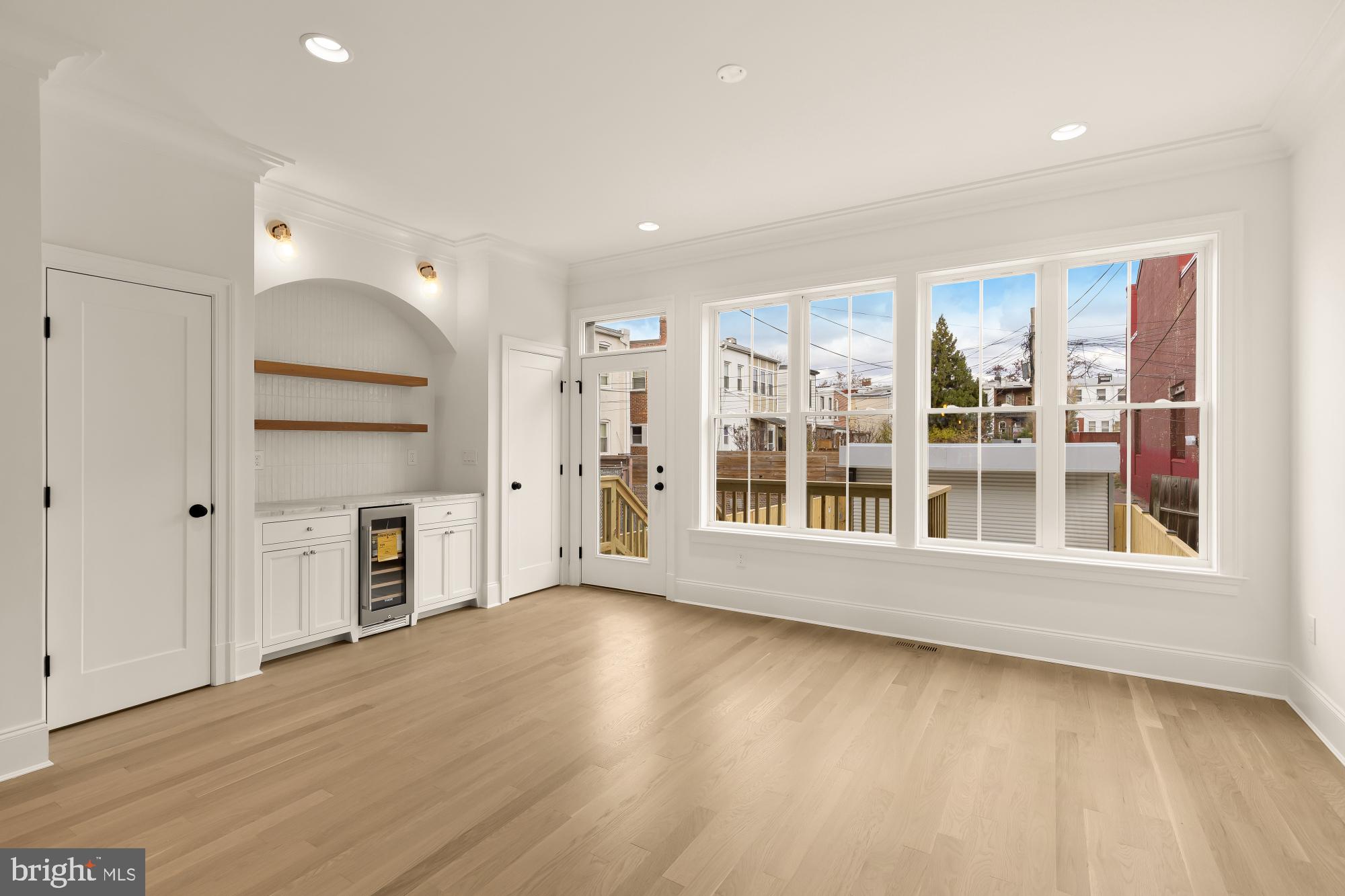 1010 I Street Northeast Washington, DC 20002 - Photo 18 of 51 a view of an empty room with a window and wooden floor