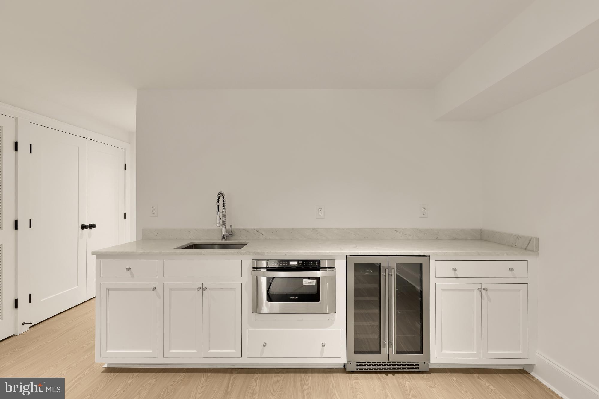 1010 I Street Northeast Washington, DC 20002 - Photo 39 of 51 a kitchen with stainless steel appliances granite countertop a sink and a granite counter tops