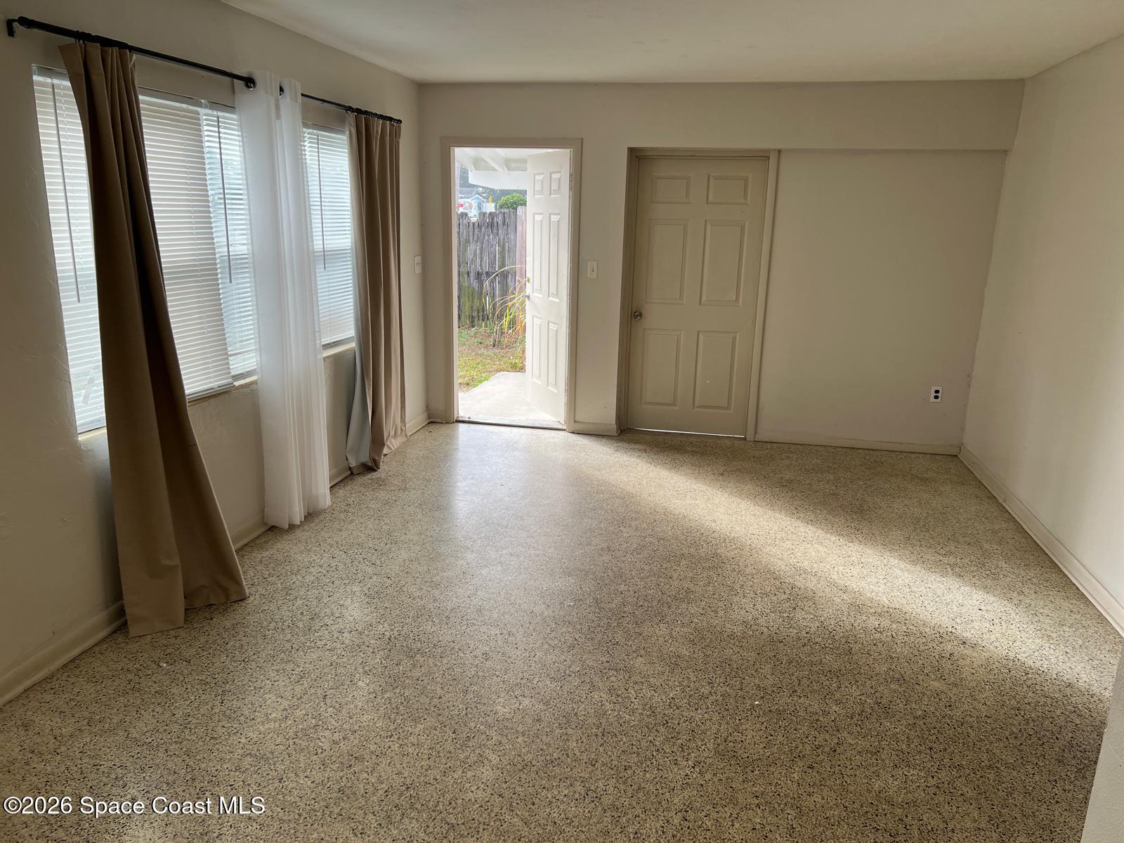 1040 Croton Road Melbourne, FL 32935 - Photo 6 of 10 an empty room with windows