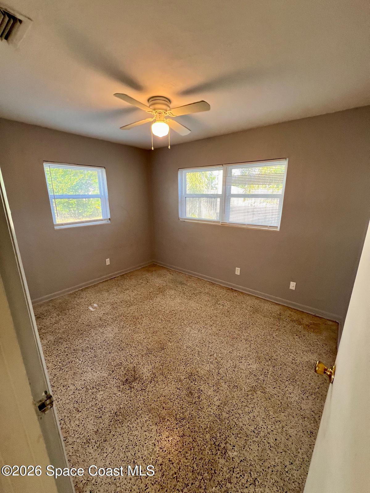 1040 Croton Road Melbourne, FL 32935 - Photo 9 of 10 a view of an empty room with a window