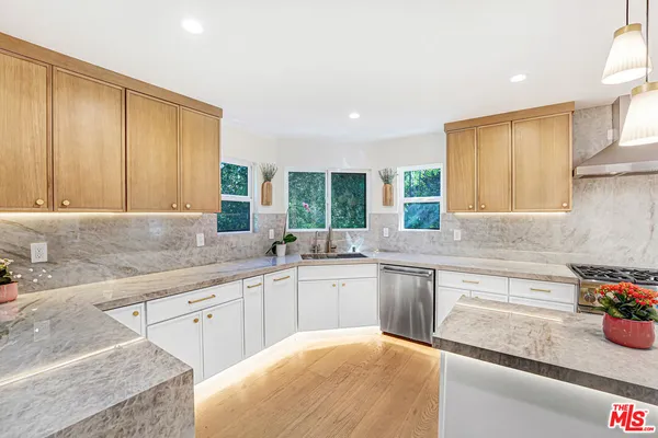 a kitchen with sink cabinets and window