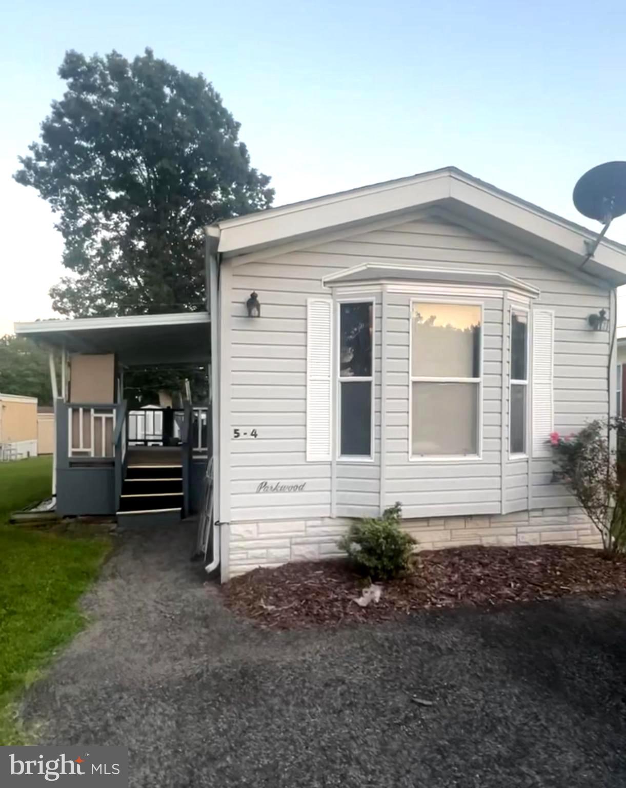 10505 Cedarville Road, Unit 54 Brandywine, MD 20613 - Photo 1 of 6 a front view of a house with a yard