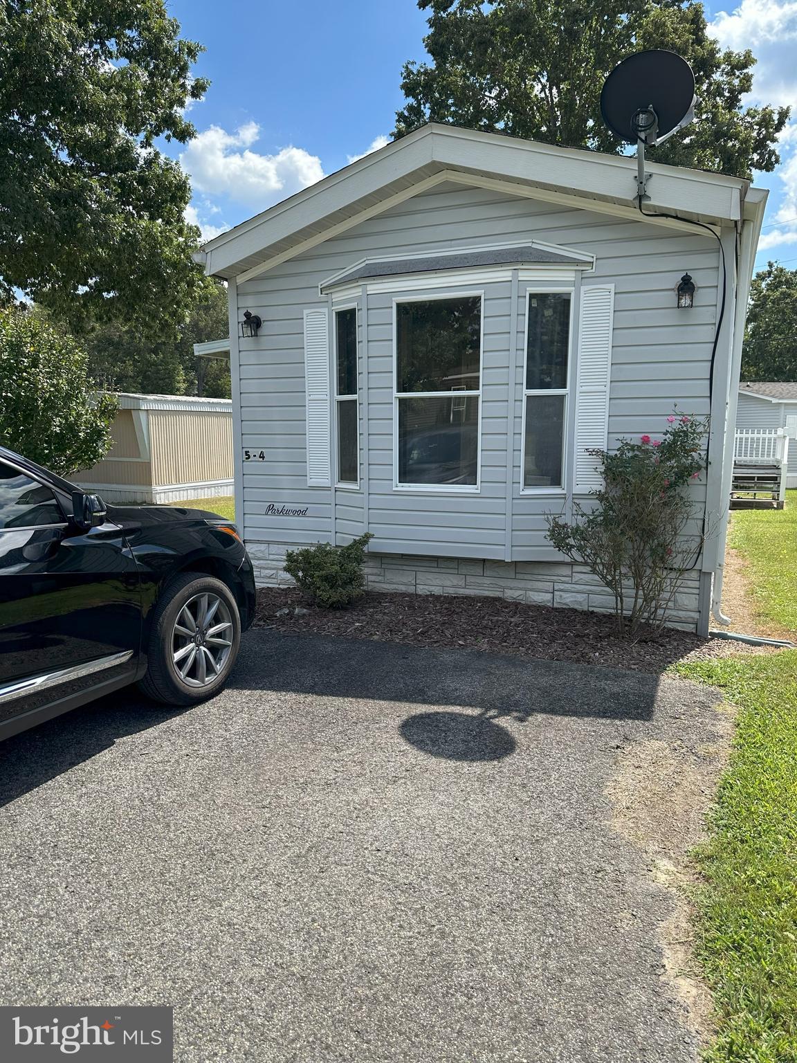 10505 Cedarville Road, Unit 54 Brandywine, MD 20613 - Photo 2 of 6 a view of a car parked front of a house