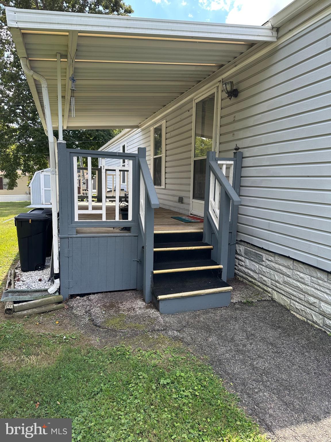 10505 Cedarville Road, Unit 54 Brandywine, MD 20613 - Photo 3 of 6 a view of a backyard with a small cabin