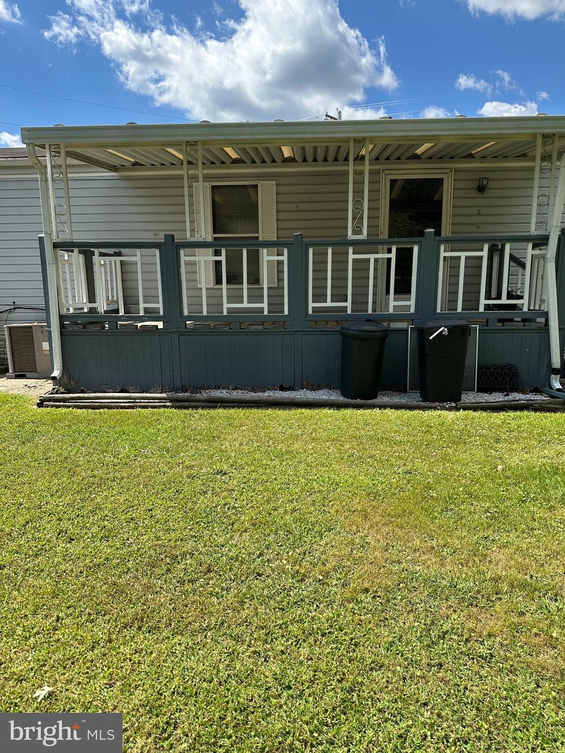 10505 Cedarville Road, Unit 54 Brandywine, MD 20613 - Photo 4 of 6 a front view of a house with a yard