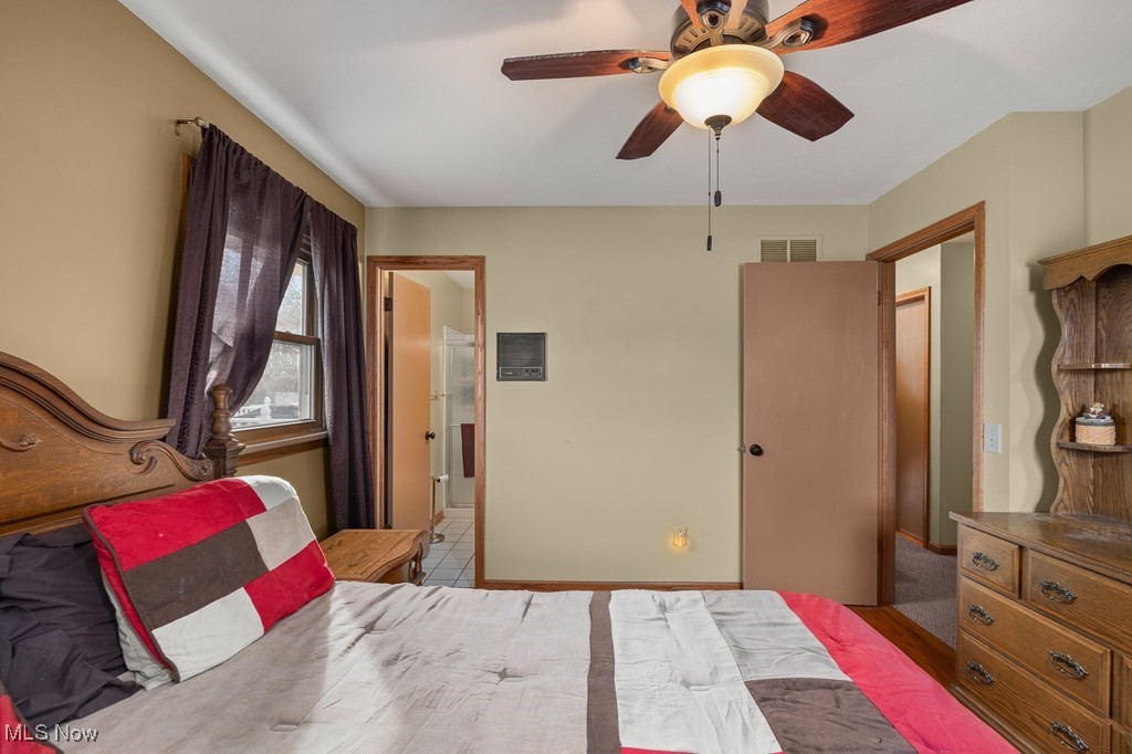 8238 Ruff Road West Salem, OH 44287 - Photo 20 of 27 Bedroom featuring ensuite bathroom, ceiling fan, and visible vents