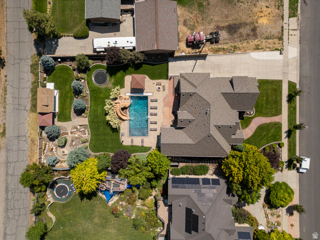687 South 2080th Street East Springville, UT 84663 - Photo 73 of 149 Expansive backyard featuring a custom-shaped swimming pool with a water slide, a built-in spa, and a surrounding paver patio
