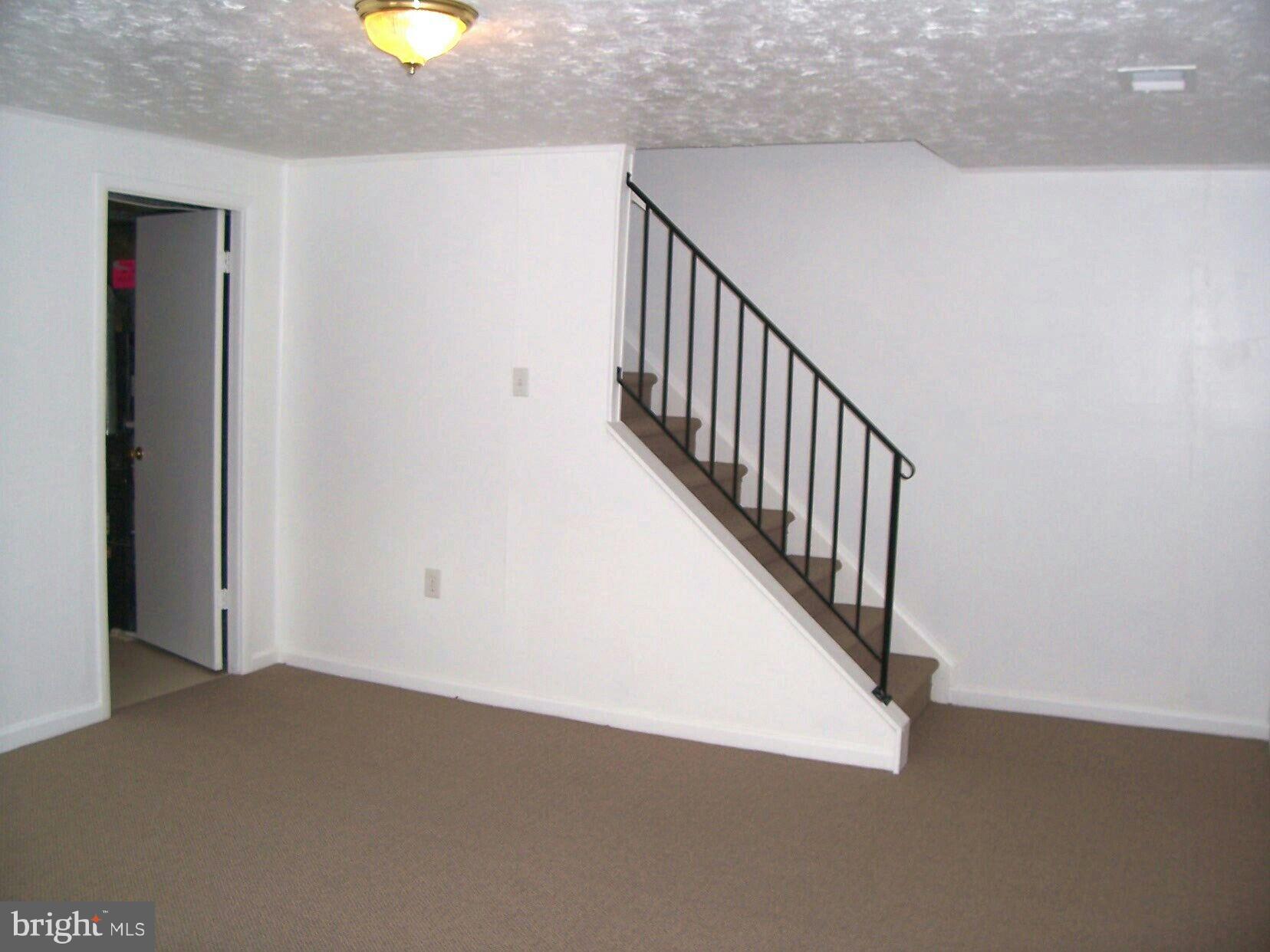 303 Redbud Road Edgewood, MD 21040 - Photo 11 of 16 a view of a hallway with staircase