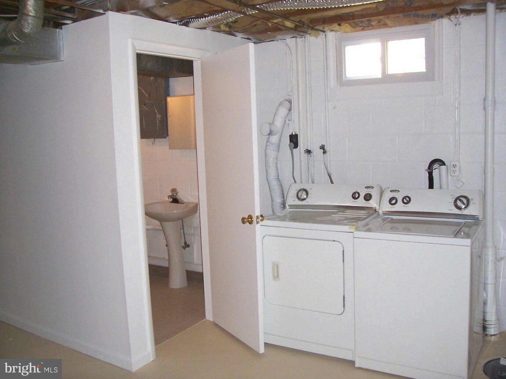 303 Redbud Road Edgewood, MD 21040 - Photo 13 of 16 a bathroom with a sink and a mirror