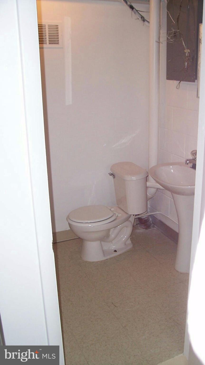 303 Redbud Road Edgewood, MD 21040 - Photo 14 of 16 a white toilet sitting next to a shower