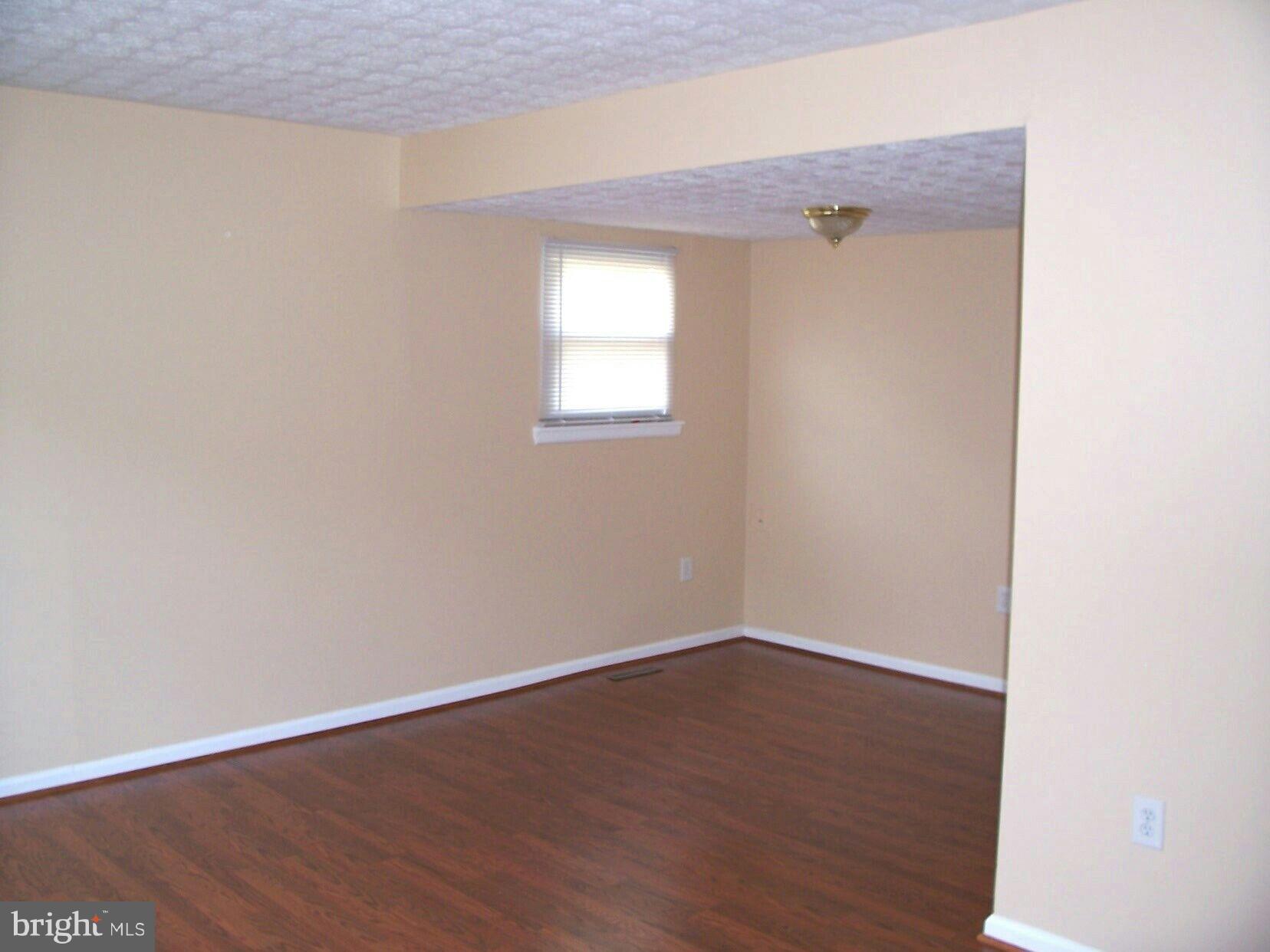 303 Redbud Road Edgewood, MD 21040 - Photo 3 of 16 a view of a small space with wooden floor and a window