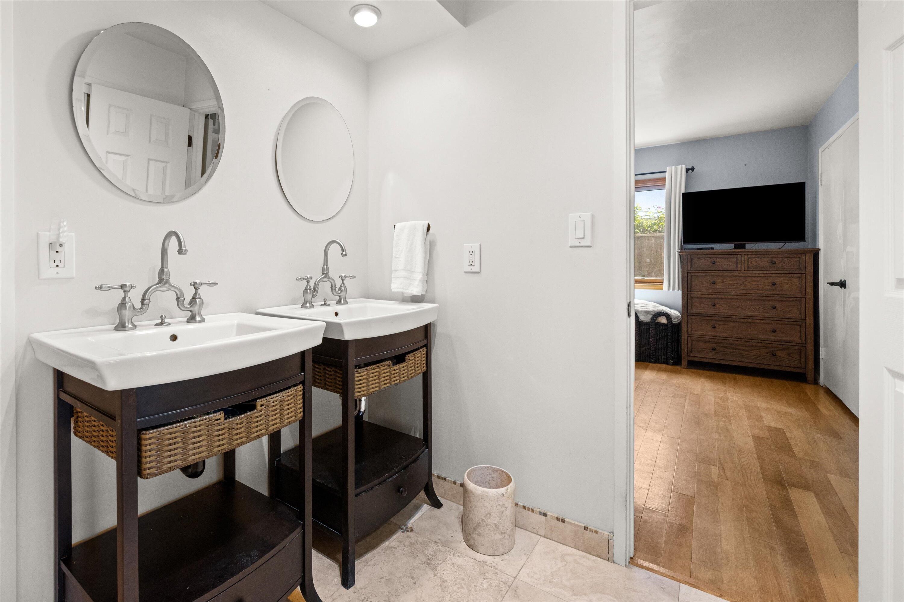 231 Salida Del Sol Santa Barbara, CA 93109 - Photo 15 of 30 a bathroom with a sink a toilet and a mirror