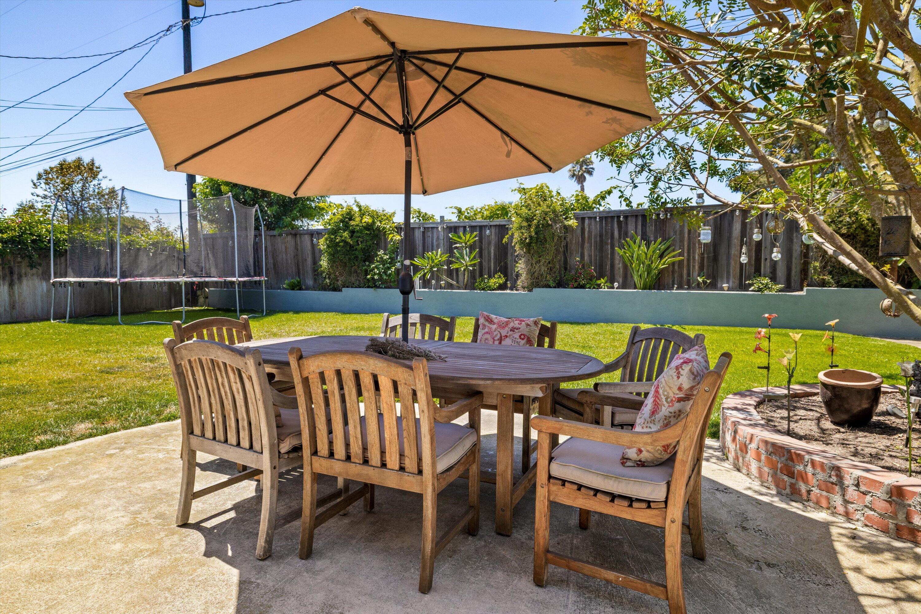 231 Salida Del Sol Santa Barbara, CA 93109 - Photo 21 of 30 a view of a swimming pool with a table and chairs under an umbrella