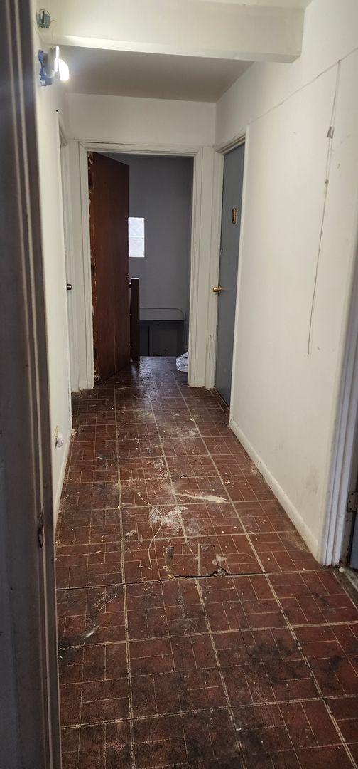 9312 South Halsted Street Chicago, IL 60620 - Photo 21 of 32 a view of a hallway