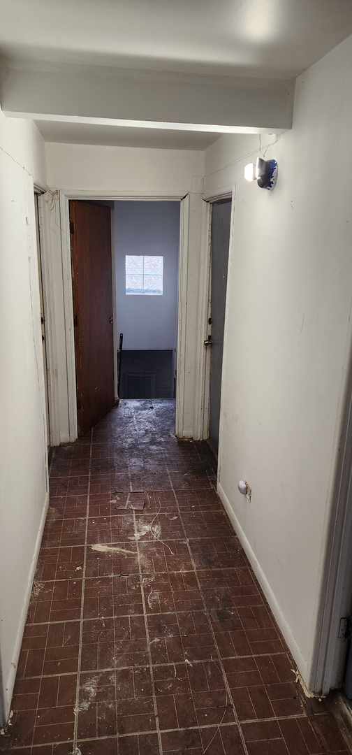 9312 South Halsted Street Chicago, IL 60620 - Photo 30 of 32 a view of a hallway