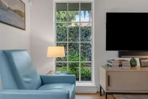 a living room with couch and a flat screen tv