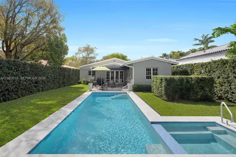 a view of house with swimming pool yard and outdoor seating