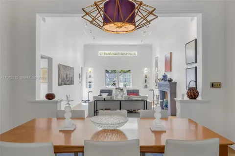 a living room with fireplace furniture and a table