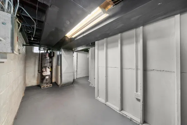 a view of empty room with wooden walls