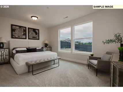 a spacious bedroom with a large bed and a large window