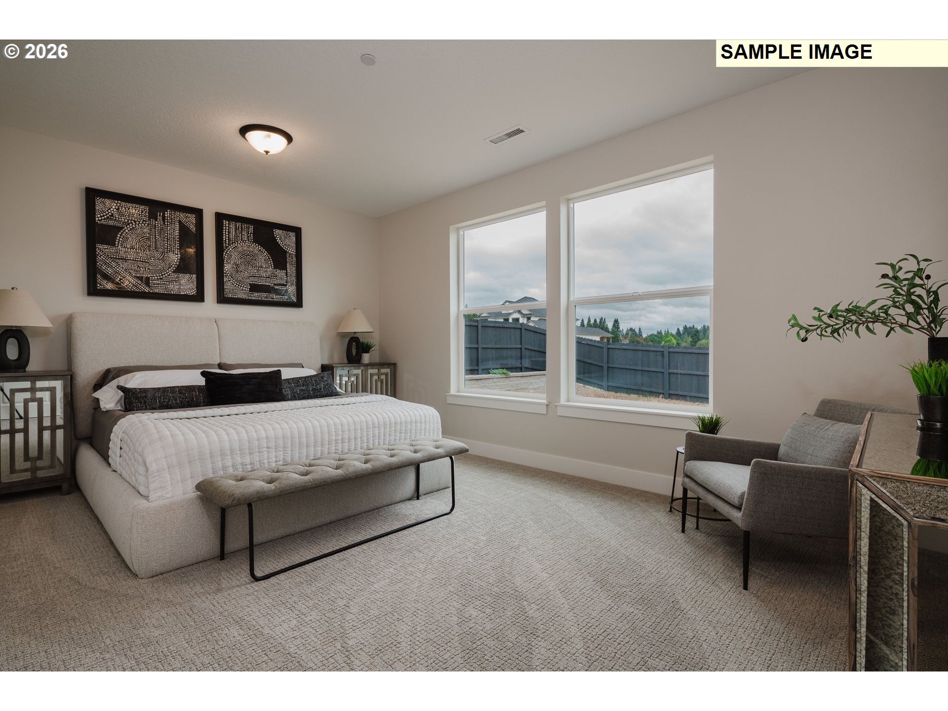 1403 North 41st Place Ridgefield, WA 98642 - Photo 16 of 30 a spacious bedroom with a large bed and a large window