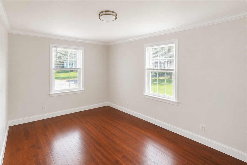 96 Walnut Lane, Unit B Attleboro, MA 02703 - Photo 13 of 20 an empty room with wooden floor and windows