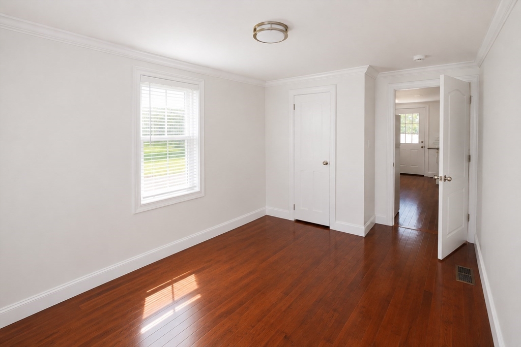 96 Walnut Lane, Unit B Attleboro, MA 02703 - Photo 15 of 20 an empty room with wooden floor and a window