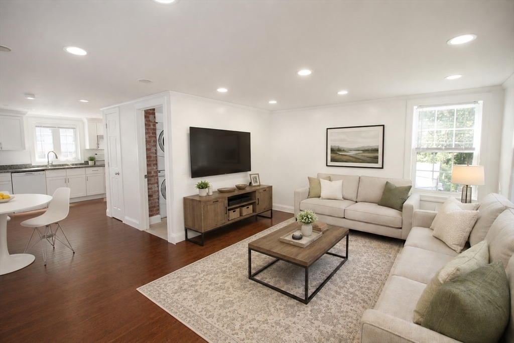 96 Walnut Lane, Unit B Attleboro, MA 02703 - Photo 3 of 20 a living room with furniture and a flat screen tv