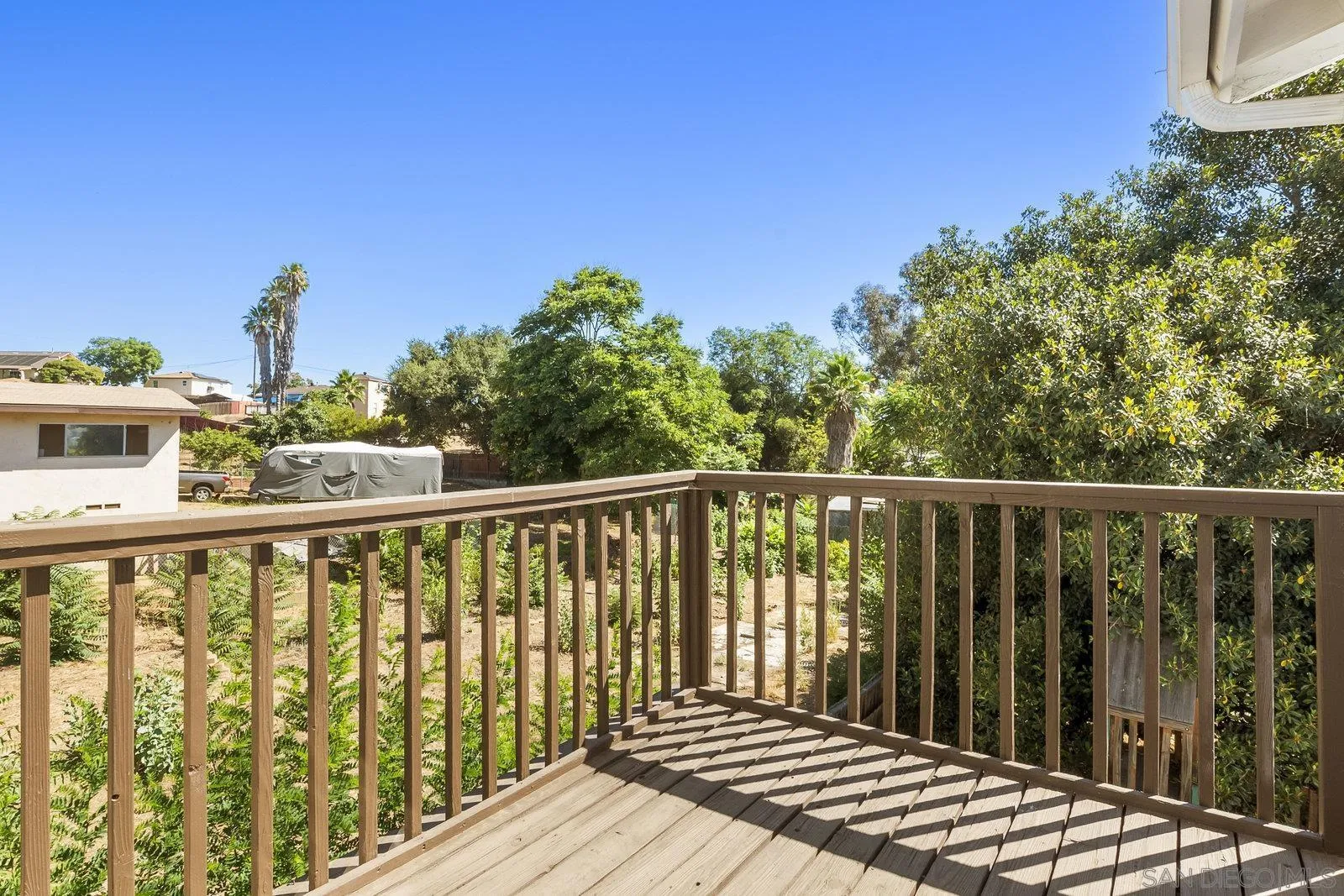 8545 Gardena Road Lakeside, CA 92040 - Photo 11 of 67 a balcony with wooden floor and fence