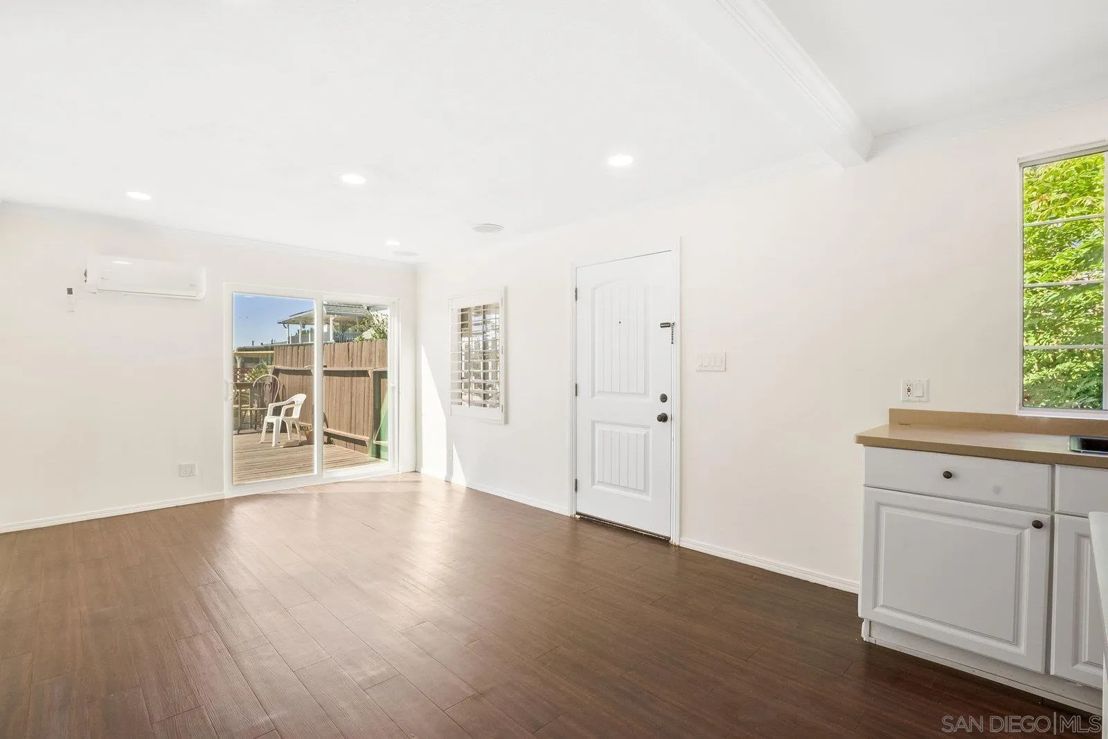 8545 Gardena Road Lakeside, CA 92040 - Photo 20 of 67 a view of an empty room with wooden floor and a window